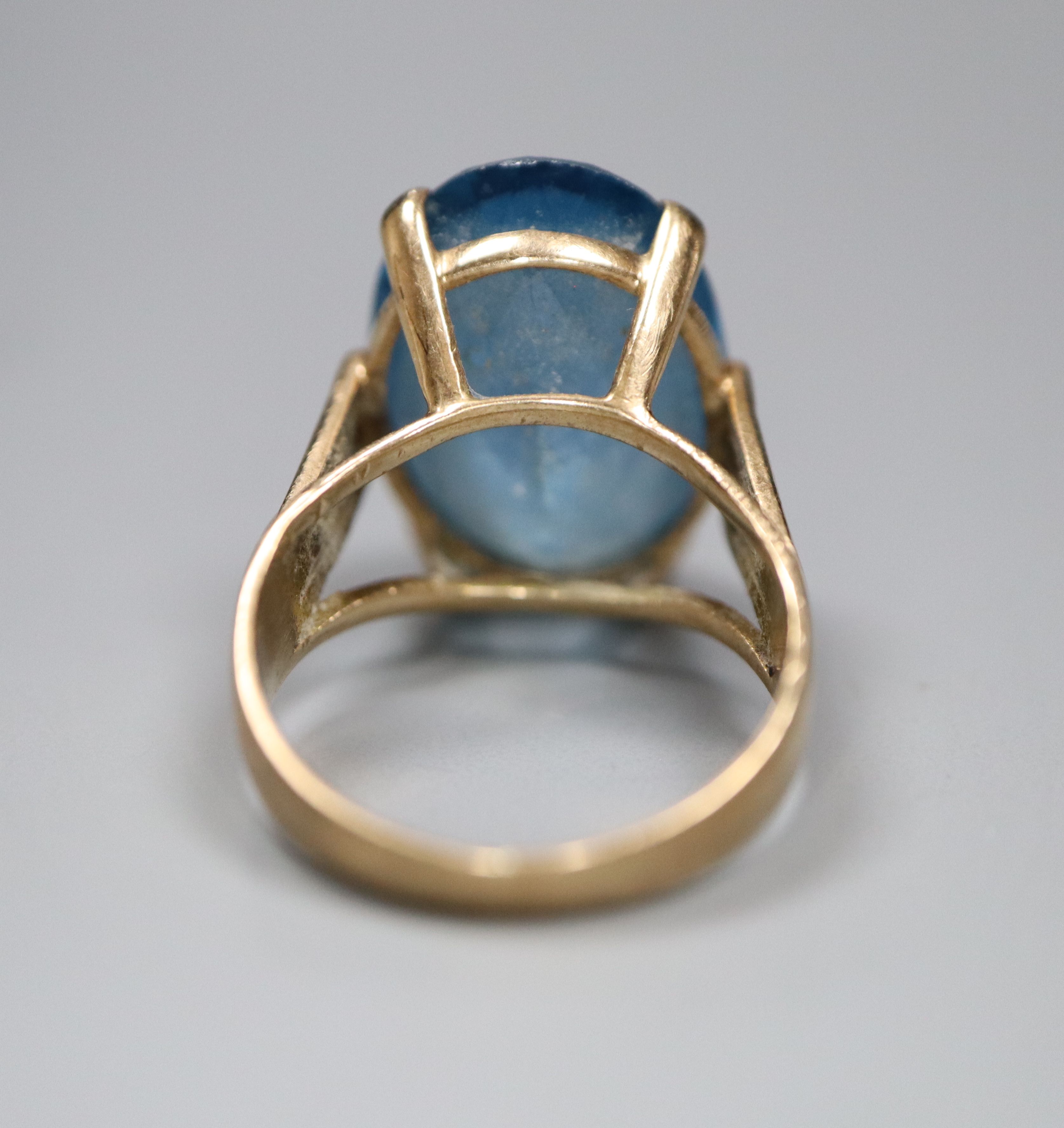 A modern 9ct god and blue paste? set oval dress ring, size K, gross 5.5 grams.